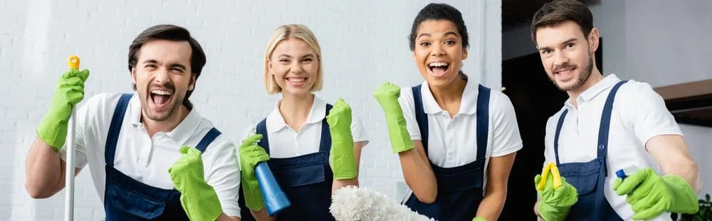 Cleaning team working through a domestic kitchen